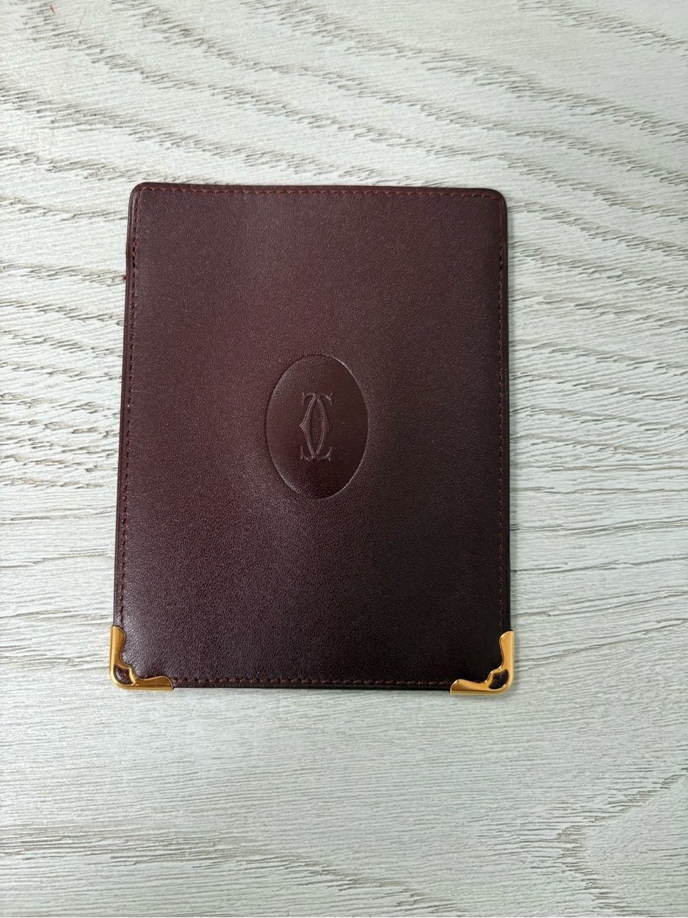 Cartier Embossed Leather Passport Holder with Gold Corner Accents - Burgundy